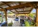 Covered patio with grill and seating area at 2028 Marker Rd, Polk City, FL 33868