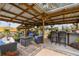 Covered patio with seating, bar, and grill at 2028 Marker Rd, Polk City, FL 33868