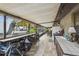 Extended screened patio with pool view and bar seating at 2028 Marker Rd, Polk City, FL 33868