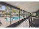 Inviting screened pool area with patio furniture and pool at 2028 Marker Rd, Polk City, FL 33868