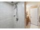 Shower with tiled walls and built-in seat at 2028 Marker Rd, Polk City, FL 33868