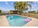Refreshing swimming pool with spacious patio and hot tub at 2028 Marker Rd, Polk City, FL 33868