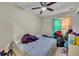 Simple bedroom with a double bed and ceiling fan at 4214 Brittany Rd, Orlando, FL 32808