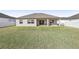Spacious backyard with a home and white fence at 7021 Bentridge Dr, Lakeland, FL 33813