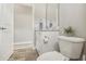 Clean bathroom with white toilet and vanity at 7021 Bentridge Dr, Lakeland, FL 33813