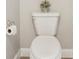 Simple bathroom with white toilet and flooring at 7021 Bentridge Dr, Lakeland, FL 33813