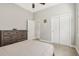 Well-lit bedroom with double doors and closet at 7021 Bentridge Dr, Lakeland, FL 33813