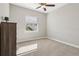 Bright bedroom featuring a window and carpeted floor at 7021 Bentridge Dr, Lakeland, FL 33813