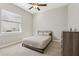 Cozy bedroom with a queen bed and dresser at 7021 Bentridge Dr, Lakeland, FL 33813