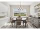 Sunlit dining room with large windows and hardwood floors at 7021 Bentridge Dr, Lakeland, FL 33813