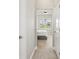 Bright hallway with carpet and access to bedroom at 7021 Bentridge Dr, Lakeland, FL 33813
