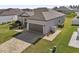 Single-story house with a two-car garage and paver driveway at 7021 Bentridge Dr, Lakeland, FL 33813