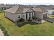 Single story home with landscaping and a two-car garage at 7021 Bentridge Dr, Lakeland, FL 33813