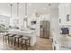 White kitchen features a large marble island and stainless steel appliances at 7021 Bentridge Dr, Lakeland, FL 33813
