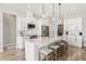 Modern kitchen boasts white cabinets, marble island and stainless steel appliances at 7021 Bentridge Dr, Lakeland, FL 33813