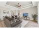Relaxing living room with hardwood floors and large TV at 7021 Bentridge Dr, Lakeland, FL 33813