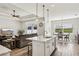 Open living room and kitchen with hardwood floors and modern decor at 7021 Bentridge Dr, Lakeland, FL 33813