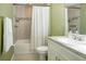 Clean bathroom with a bathtub, shower, and white vanity at 1314 W Highland St, Lakeland, FL 33815