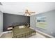 Primary bedroom with large window and ceiling fan at 1314 W Highland St, Lakeland, FL 33815