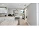 Modern kitchen with white shaker cabinets, stainless steel appliances, and an island at 1314 W Highland St, Lakeland, FL 33815