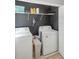 Laundry room with washer, dryer, and shelving at 1314 W Highland St, Lakeland, FL 33815