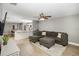 Open living area featuring a sectional sofa, hardwood floors, and a view into the kitchen at 1314 W Highland St, Lakeland, FL 33815