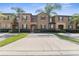 Front view of a two-story townhome at 225 Cambria Ave, Davenport, FL 33897