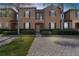 Two-story townhome with brick paver walkway at 225 Cambria Ave, Davenport, FL 33897