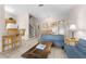 Open living room with sofa and dining area at 225 Cambria Ave, Davenport, FL 33897