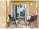 Private patio with table and chairs, perfect for relaxing at 225 Cambria Ave, Davenport, FL 33897