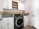 Laundry room with white cabinets and washer/dryer at 1322 Oak Crest St, Davenport, FL 33837