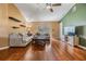 Comfortable living room featuring hardwood floors, neutral walls, and bright natural light at 4698 Harts Brook Ln, Mulberry, FL 33860