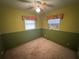 Bedroom with two windows, ceiling fan, and neutral walls at 1401 Cr 449, Lake Panasoffkee, FL 33538