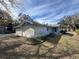 Side view of a light blue house needing some landscaping at 1401 Cr 449, Lake Panasoffkee, FL 33538