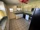 Kitchen with ample cabinetry, stainless steel appliances, and double sink at 1401 Cr 449, Lake Panasoffkee, FL 33538
