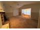 Bright living room featuring a fireplace and bay window at 1401 Cr 449, Lake Panasoffkee, FL 33538