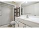 Modern bathroom with a shower, toilet and vanity at 150 El Dorado # 101, Winter Haven, FL 33884