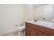 Simple bathroom with a toilet, sink, and vanity at 150 El Dorado # 101, Winter Haven, FL 33884