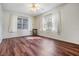 Bright bedroom with wood-look flooring and ample natural light at 150 El Dorado # 101, Winter Haven, FL 33884