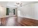 Simple bedroom with wood-look flooring and a ceiling fan at 150 El Dorado # 101, Winter Haven, FL 33884