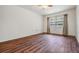 Spacious bedroom featuring wood-look flooring and a ceiling fan at 150 El Dorado # 101, Winter Haven, FL 33884