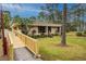 Exterior view of building with ramp access at 150 El Dorado # 101, Winter Haven, FL 33884
