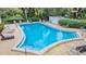 Relaxing kidney-shaped community pool at 150 El Dorado # 101, Winter Haven, FL 33884