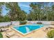 Inviting community pool with lounge chairs at 150 El Dorado # 101, Winter Haven, FL 33884