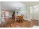 Simple dining area with wood table and chairs, and laminate flooring at 150 El Dorado # 101, Winter Haven, FL 33884