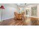 Charming dining area with wood table and chairs, perfect for Gathering meals at 150 El Dorado # 101, Winter Haven, FL 33884