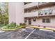 Building exterior with parking and landscaping at 150 El Dorado # 101, Winter Haven, FL 33884