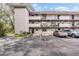 Exterior view of a condo building showcasing its architecture and parking at 150 El Dorado # 101, Winter Haven, FL 33884