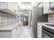 Modern kitchen with stainless steel appliances and ample counter space at 150 El Dorado # 101, Winter Haven, FL 33884