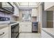 Clean and efficient kitchen with stainless steel appliances and white cabinets at 150 El Dorado # 101, Winter Haven, FL 33884
